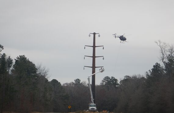 photo 3 transmission line installation using helicopter